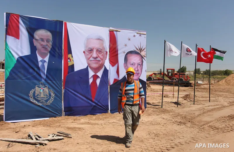 Palestinian construction labourers work on a Turkish funded project to build 320 housing units for families who lost their homes during the 50-day war between Israel and Hamas-led militants in the summer of 2014, east of...