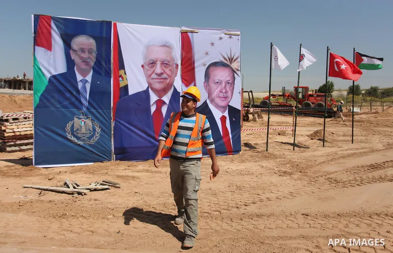 Palestinian construction labourers work on a Turkish funded project to build 320 housing units for families who lost their homes during the 50-day war between Israel and Hamas-led militants in the summer of 2014, east of...
