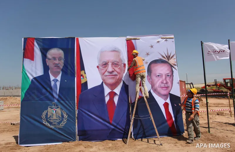 Palestinian construction labourers work on a Turkish funded project to build 320 housing units for families who lost their homes during the 50-day war between Israel and Hamas-led militants in the summer of 2014, east of...