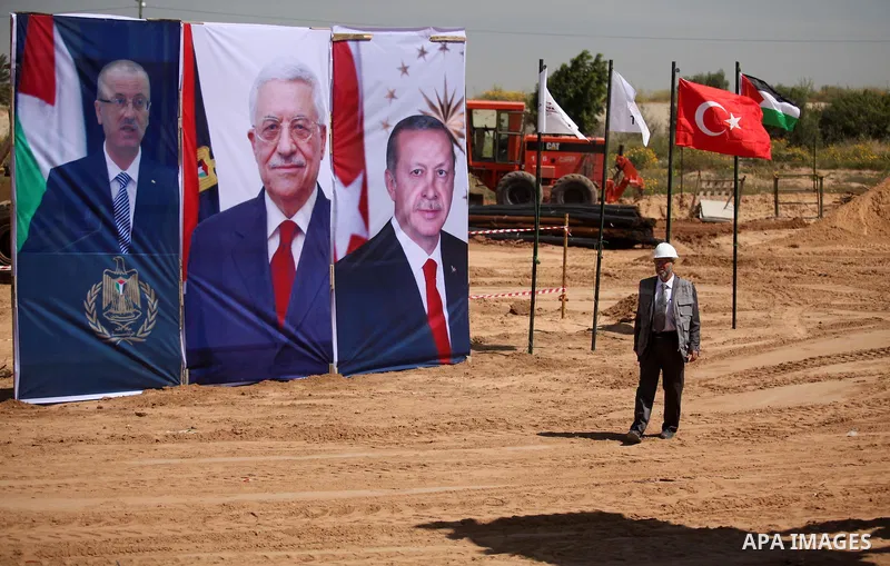 Palestinian construction labourers work on a Turkish funded project to build 320 housing units for families who lost their homes during the 50-day war between Israel and Hamas-led militants in the summer of 2014, east of...