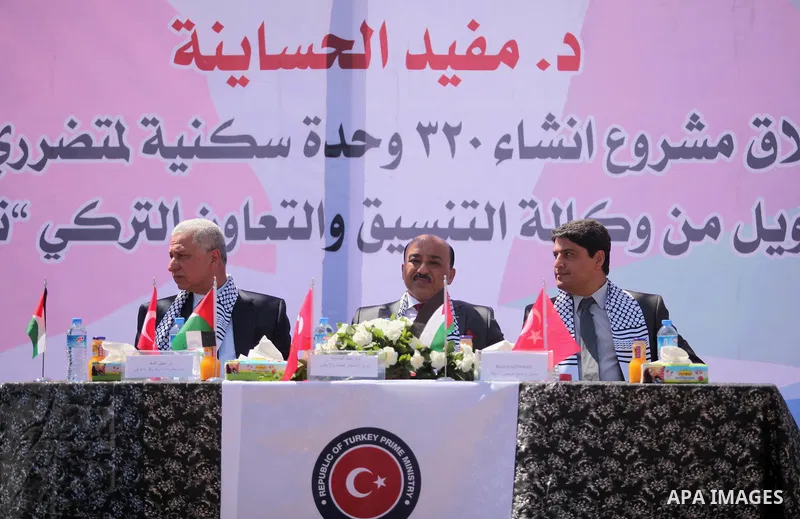 Palestinian housing minister Mufeed al-Hasayna, and representative of the Turkish Cooperation and Coordination Agency "TİKA", Bulent Korkmaz attend a Turkish funded project to build 320 housing units for families who los...