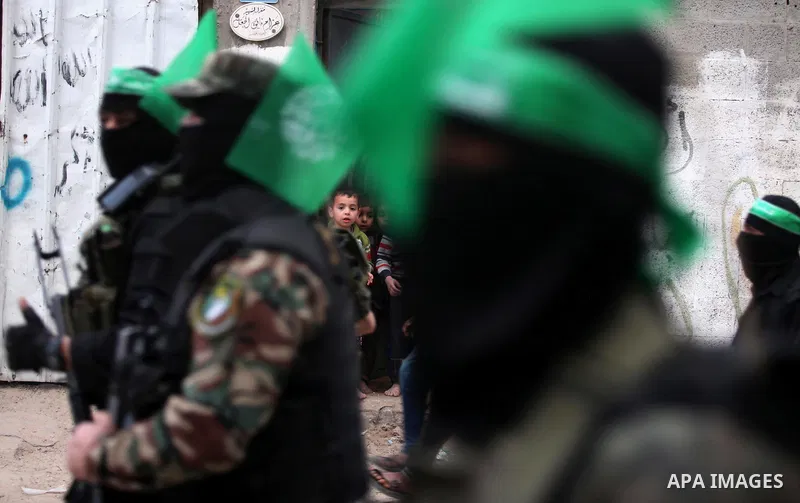 Members of the Ezzedine al-Qassam Brigades, the military wing of the Palestinian Islamist movement Hamas take part during a rally to mark the 12th anniversary of the death of assassinated Hamas spiritual leader Sheikh Ah...