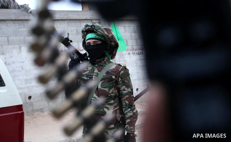 Members of the Ezzedine al-Qassam Brigades, the military wing of the Palestinian Islamist movement Hamas take part during a rally to mark the 12th anniversary of the death of assassinated Hamas spiritual leader Sheikh Ah...