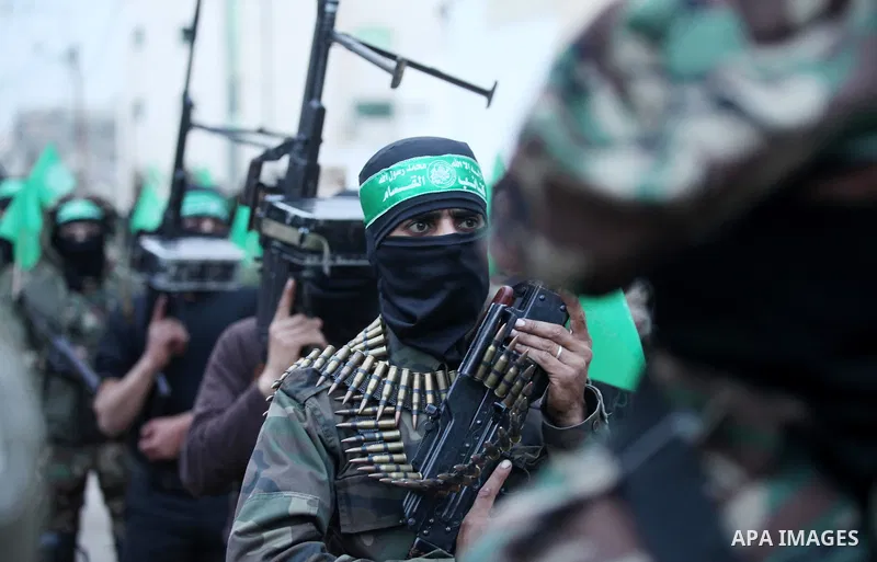 Members of the Ezzedine al-Qassam Brigades, the military wing of the Palestinian Islamist movement Hamas take part during a rally to mark the 12th anniversary of the death of assassinated Hamas spiritual leader Sheikh Ah...