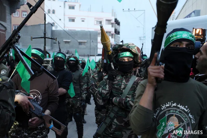Members of the Ezzedine al-Qassam Brigades, the military wing of the Palestinian Islamist movement Hamas take part during a rally to mark the 12th anniversary of the death of assassinated Hamas spiritual leader Sheikh Ah...