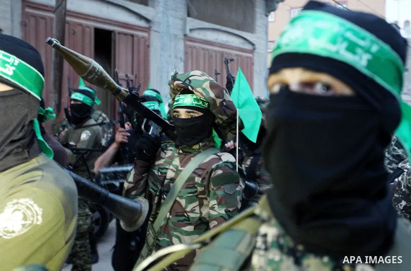 Members of the Ezzedine al-Qassam Brigades, the military wing of the Palestinian Islamist movement Hamas take part during a rally to mark the 12th anniversary of the death of assassinated Hamas spiritual leader Sheikh Ah...