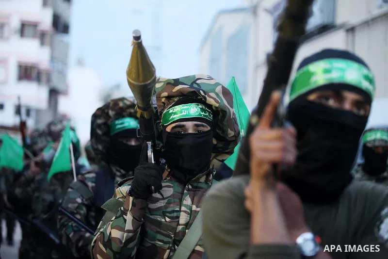 Members of the Ezzedine al-Qassam Brigades, the military wing of the Palestinian Islamist movement Hamas take part during a rally to mark the 12th anniversary of the death of assassinated Hamas spiritual leader Sheikh Ah...