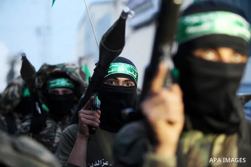 Members of the Ezzedine al-Qassam Brigades, the military wing of the Palestinian Islamist movement Hamas take part during a rally to mark the 12th anniversary of the death of assassinated Hamas spiritual leader Sheikh Ah...