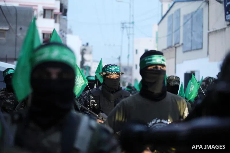 Members of the Ezzedine al-Qassam Brigades, the military wing of the Palestinian Islamist movement Hamas take part during a rally to mark the 12th anniversary of the death of assassinated Hamas spiritual leader Sheikh Ah...