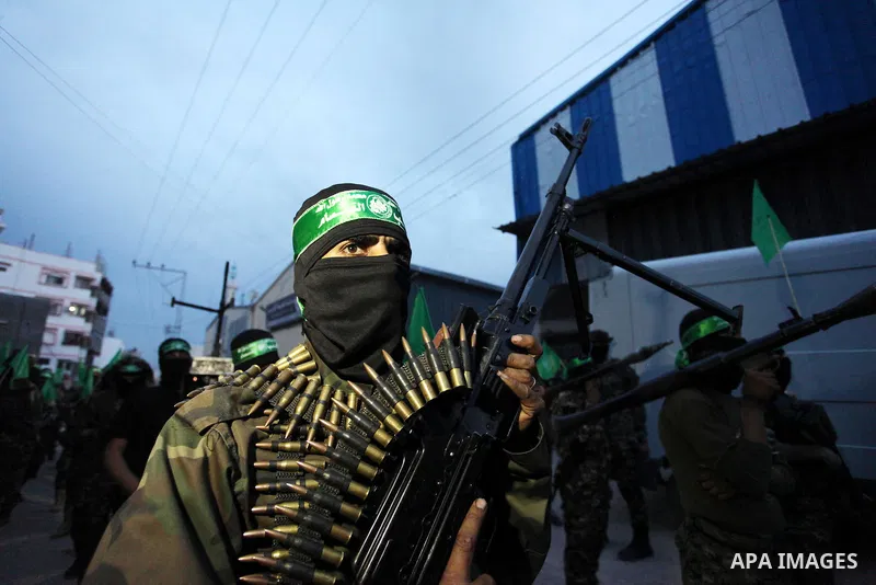 Members of the Ezzedine al-Qassam Brigades, the military wing of the Palestinian Islamist movement Hamas take part during a rally to mark the 12th anniversary of the death of assassinated Hamas spiritual leader Sheikh Ah...