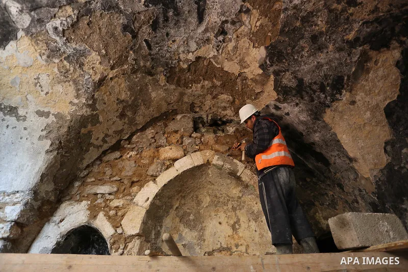 A Palestinian worker renovates the archaeological Maqam Al-Khader, in Deir al-Balah, central Gaza on March 24, 2016. Maqam Al-Kader is one of the monuments of the city of Deir al-Balah, the Ministry of Tourism and Antiqu...