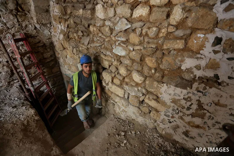 A Palestinian worker renovates the archaeological Maqam Al-Khader, in Deir al-Balah, central Gaza on March 24, 2016. Maqam Al-Kader is one of the monuments of the city of Deir al-Balah, the Ministry of Tourism and Antiqu...