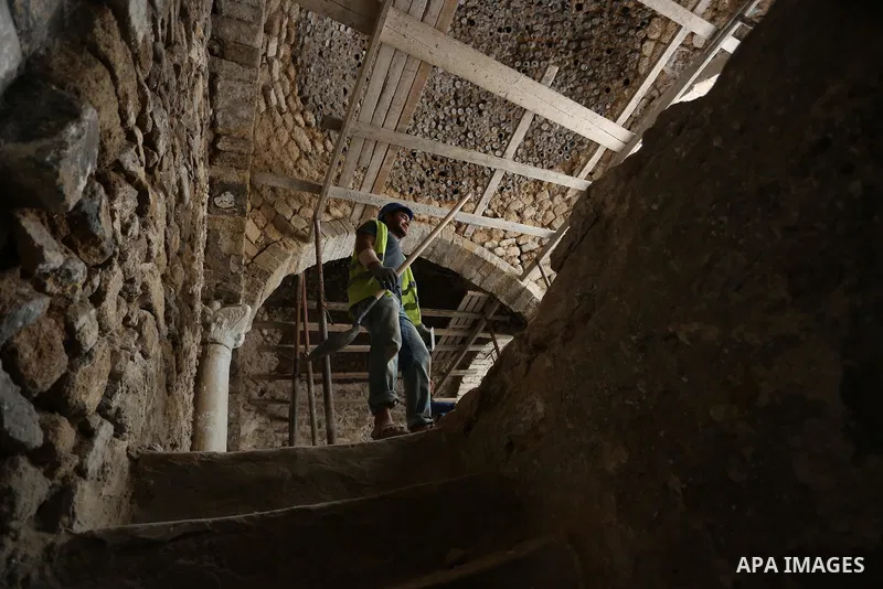 A Palestinian worker renovates the archaeological Maqam Al-Khader, in Deir al-Balah, central Gaza on March 24, 2016. Maqam Al-Kader is one of the monuments of the city of Deir al-Balah, the Ministry of Tourism and Antiqu...