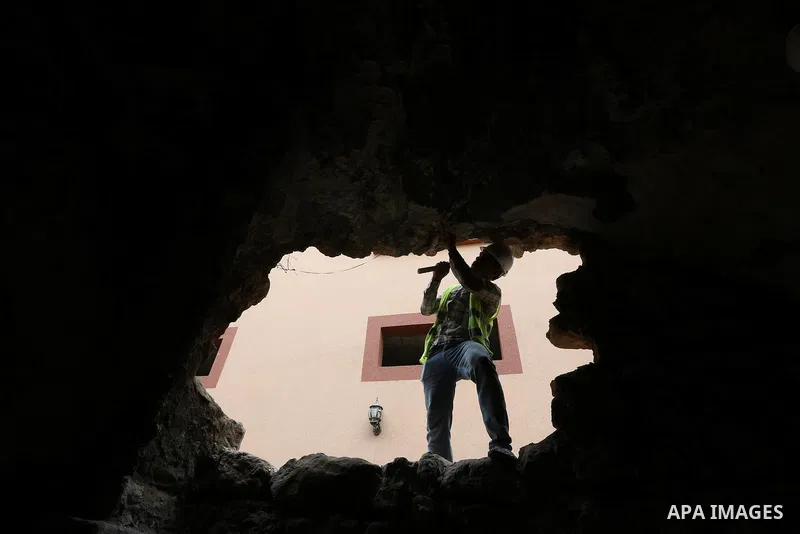A Palestinian worker renovates the archaeological Maqam Al-Khader, in Deir al-Balah, central Gaza on March 24, 2016. Maqam Al-Kader is one of the monuments of the city of Deir al-Balah, the Ministry of Tourism and Antiqu...