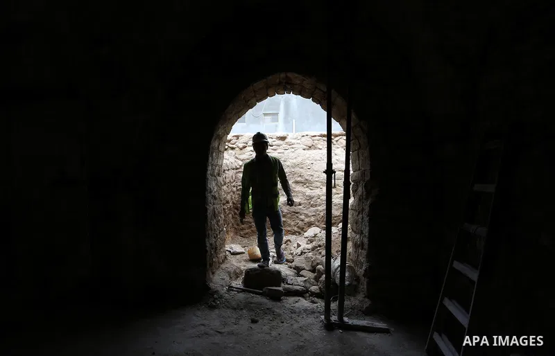 A Palestinian worker renovates the archaeological Maqam Al-Khader, in Deir al-Balah, central Gaza on March 24, 2016. Maqam Al-Kader is one of the monuments of the city of Deir al-Balah, the Ministry of Tourism and Antiqu...