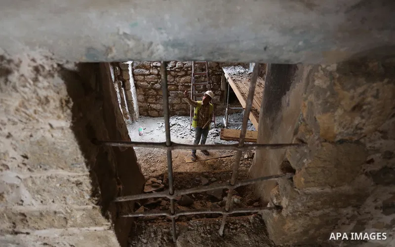 A Palestinian worker renovates the archaeological Maqam Al-Khader, in Deir al-Balah, central Gaza on March 24, 2016. Maqam Al-Kader is one of the monuments of the city of Deir al-Balah, the Ministry of Tourism and Antiqu...