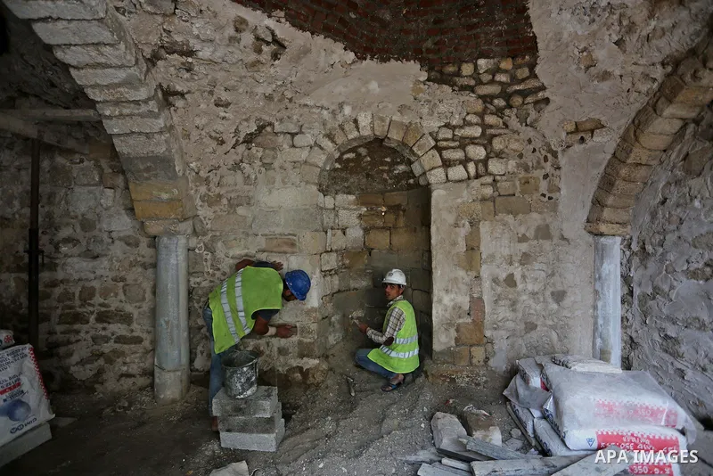 Palestinian workers renovate the archaeological Maqam Al-Khader, in Deir al-Balah, central Gaza on March 24, 2016. Maqam Al-Kader is one of the monuments of the city of Deir al-Balah, the Ministry of Tourism and Antiquit...
