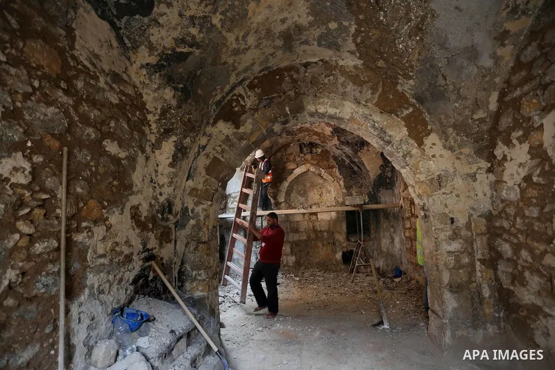 A Palestinian worker renovates the archaeological Maqam Al-Khader, in Deir al-Balah, central Gaza on March 24, 2016. Maqam Al-Kader is one of the monuments of the city of Deir al-Balah, the Ministry of Tourism and Antiqu...