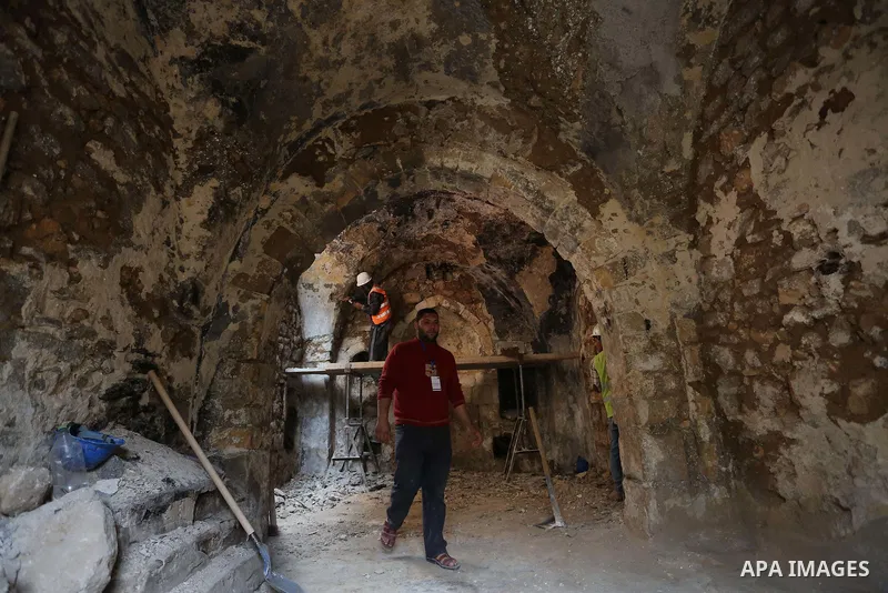 A Palestinian worker renovates the archaeological Maqam Al-Khader, in Deir al-Balah, central Gaza on March 24, 2016. Maqam Al-Kader is one of the monuments of the city of Deir al-Balah, the Ministry of Tourism and Antiqu...