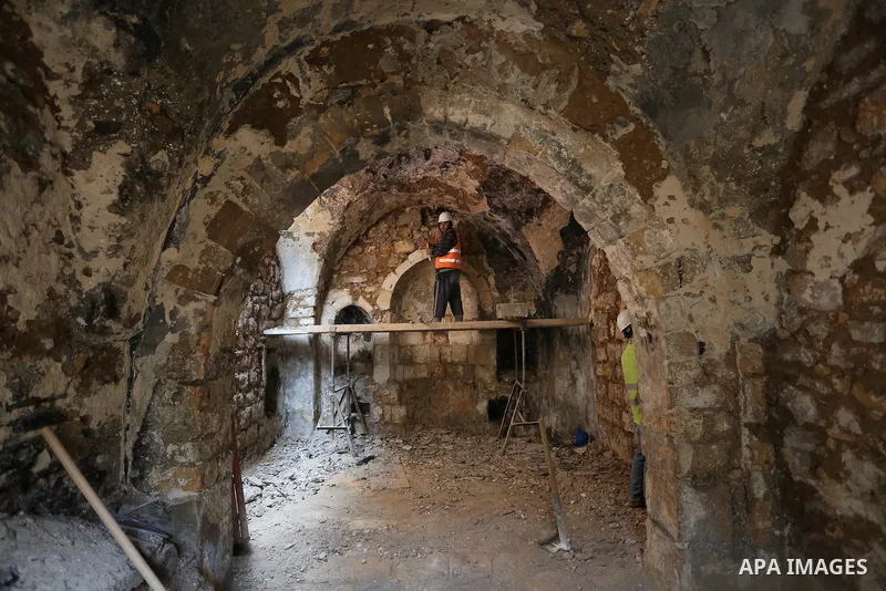 A Palestinian worker renovates the archaeological Maqam Al-Khader, in Deir al-Balah, central Gaza on March 24, 2016. Maqam Al-Kader is one of the monuments of the city of Deir al-Balah, the Ministry of Tourism and Antiqu...