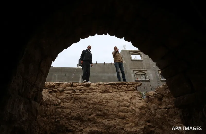Palestinian workers renovate the archaeological Maqam Al-Khader, in Deir al-Balah, central Gaza on March 24, 2016. Maqam Al-Kader is one of the monuments of the city of Deir al-Balah, the Ministry of Tourism and Antiquit...