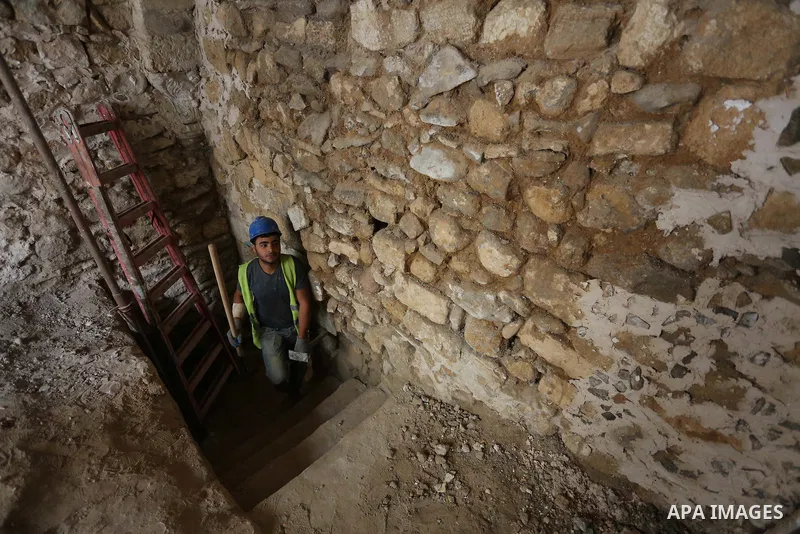 A Palestinian worker renovates the archaeological Maqam Al-Khader, in Deir al-Balah, central Gaza on March 24, 2016. Maqam Al-Kader is one of the monuments of the city of Deir al-Balah, the Ministry of Tourism and Antiqu...