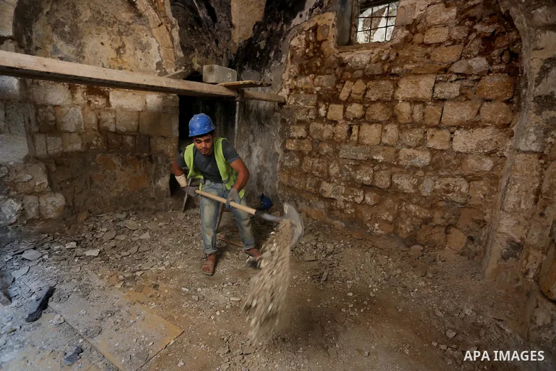 A Palestinian worker renovates the archaeological Maqam Al-Khader, in Deir al-Balah, central Gaza on March 24, 2016. Maqam Al-Kader is one of the monuments of the city of Deir al-Balah, the Ministry of Tourism and Antiqu...
