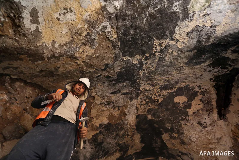 A Palestinian worker renovates the archaeological Maqam Al-Khader, in Deir al-Balah, central Gaza on March 24, 2016. Maqam Al-Kader is one of the monuments of the city of Deir al-Balah, the Ministry of Tourism and Antiqu...