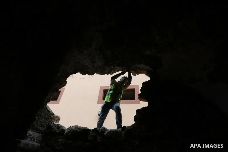 A Palestinian worker renovates the archaeological Maqam Al-Khader, in Deir al-Balah, central Gaza on March 24, 2016. Maqam Al-Kader is one of the monuments of the city of Deir al-Balah, the Ministry of Tourism and Antiqu...