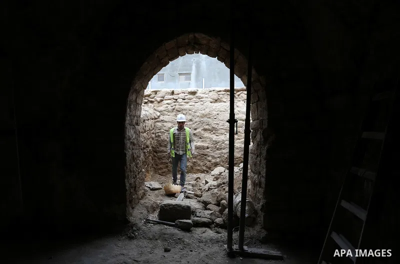 A Palestinian worker renovates the archaeological Maqam Al-Khader, in Deir al-Balah, central Gaza on March 24, 2016. Maqam Al-Kader is one of the monuments of the city of Deir al-Balah, the Ministry of Tourism and Antiqu...