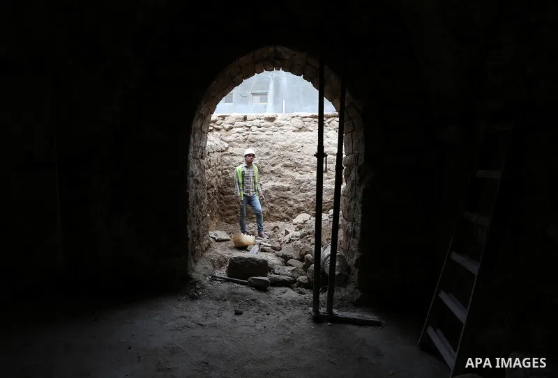 A Palestinian worker renovates the archaeological Maqam Al-Khader, in Deir al-Balah, central Gaza on March 24, 2016. Maqam Al-Kader is one of the monuments of the city of Deir al-Balah, the Ministry of Tourism and Antiqu...