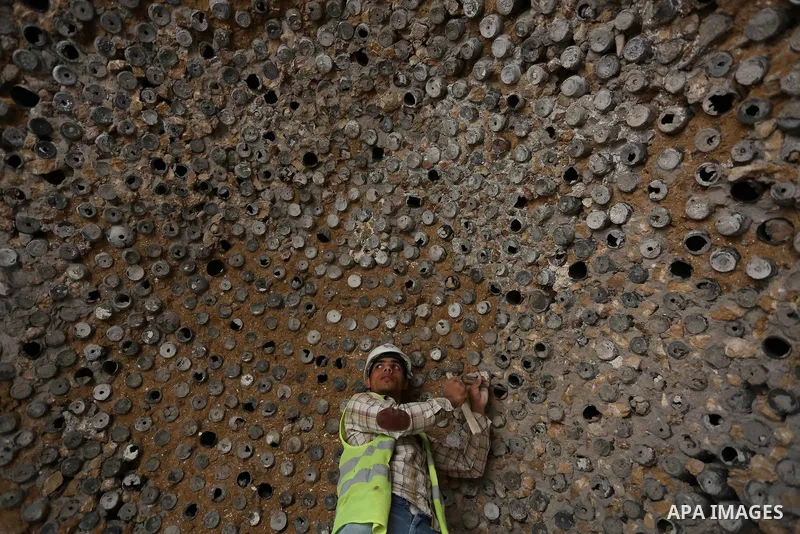A Palestinian worker renovates the archaeological Maqam Al-Khader, in Deir al-Balah, central Gaza on March 24, 2016. Maqam Al-Kader is one of the monuments of the city of Deir al-Balah, the Ministry of Tourism and Antiqu...