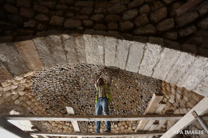 A Palestinian worker renovates the archaeological Maqam Al-Khader, in Deir al-Balah, central Gaza on March 24, 2016. Maqam Al-Kader is one of the monuments of the city of Deir al-Balah, the Ministry of Tourism and Antiqu...