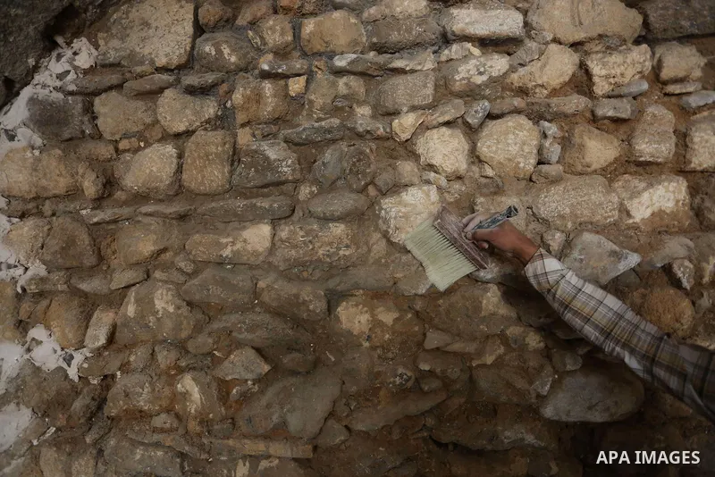 A Palestinian worker renovates the archaeological Maqam Al-Khader, in Deir al-Balah, central Gaza on March 24, 2016. Maqam Al-Kader is one of the monuments of the city of Deir al-Balah, the Ministry of Tourism and Antiqu...
