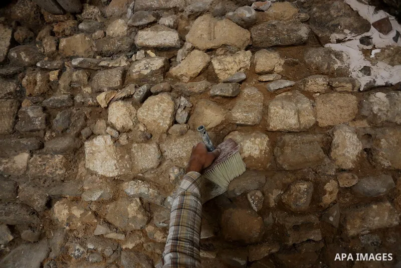 A Palestinian worker renovates the archaeological Maqam Al-Khader, in Deir al-Balah, central Gaza on March 24, 2016. Maqam Al-Kader is one of the monuments of the city of Deir al-Balah, the Ministry of Tourism and Antiqu...