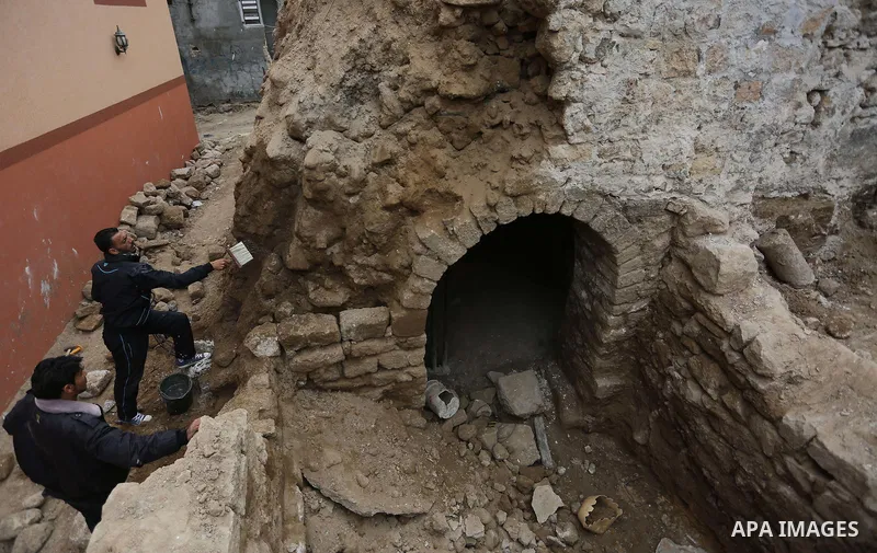 A Palestinian worker renovates the archaeological Maqam Al-Khader, in Deir al-Balah, central Gaza on March 24, 2016. Maqam Al-Kader is one of the monuments of the city of Deir al-Balah, the Ministry of Tourism and Antiqu...
