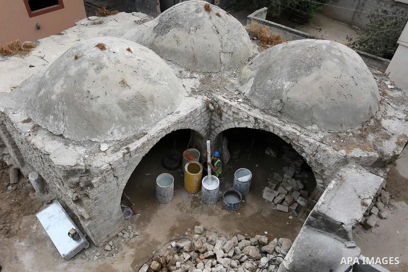 Palestinian workers renovate the archaeological Maqam Al-Khader, in Deir al-Balah, central Gaza on March 24, 2016. Maqam Al-Kader is one of the monuments of the city of Deir al-Balah, the Ministry of Tourism and Antiquit...