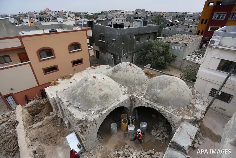 Palestinian workers renovate the archaeological Maqam Al-Khader, in Deir al-Balah, central Gaza on March 24, 2016. Maqam Al-Kader is one of the monuments of the city of Deir al-Balah, the Ministry of Tourism and Antiquit...