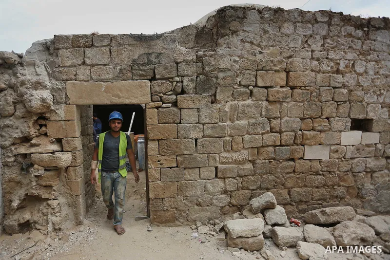 A Palestinian worker renovates the archaeological Maqam Al-Khader, in Deir al-Balah, central Gaza on March 24, 2016. Maqam Al-Kader is one of the monuments of the city of Deir al-Balah, the Ministry of Tourism and Antiqu...