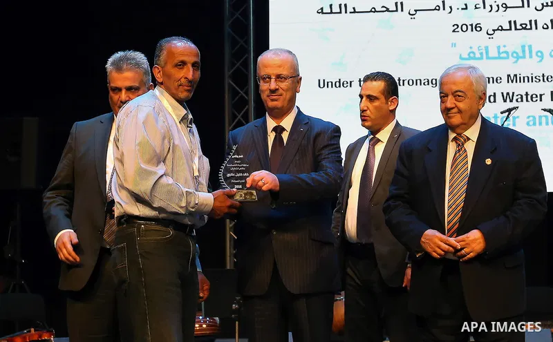 Palestinian Prime Minister, Rami Hamdallah, attends a celebrate of World Water Day, in the West Bank city Ramallah, on March 24, 2016. Photo by Prime Minister Office