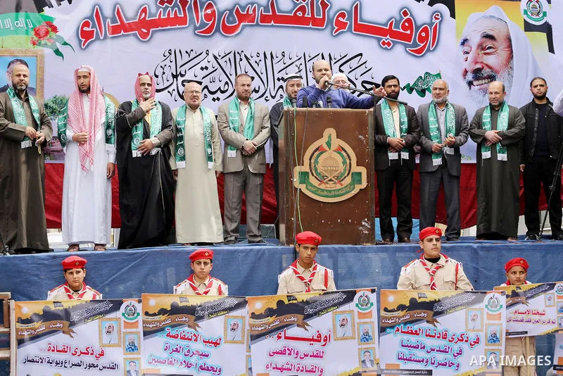 Palestinian supporters of Hamas movement take part during a rally to mark the 12th anniversary of the death of assassinated Hamas spiritual leader Sheikh Ahmed Yassine and show solidarity with Palestinians in Jerusalem a...