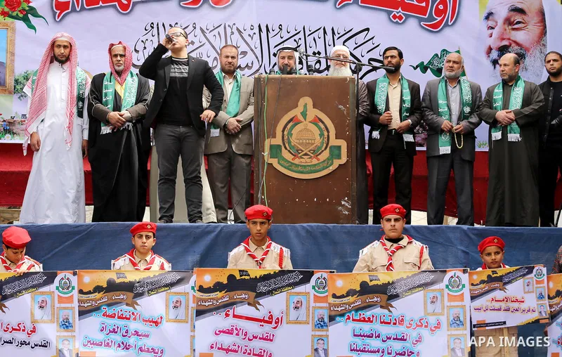 Palestinian supporters of Hamas movement take part during a rally to mark the 12th anniversary of the death of assassinated Hamas spiritual leader Sheikh Ahmed Yassine and show solidarity with Palestinians in Jerusalem a...