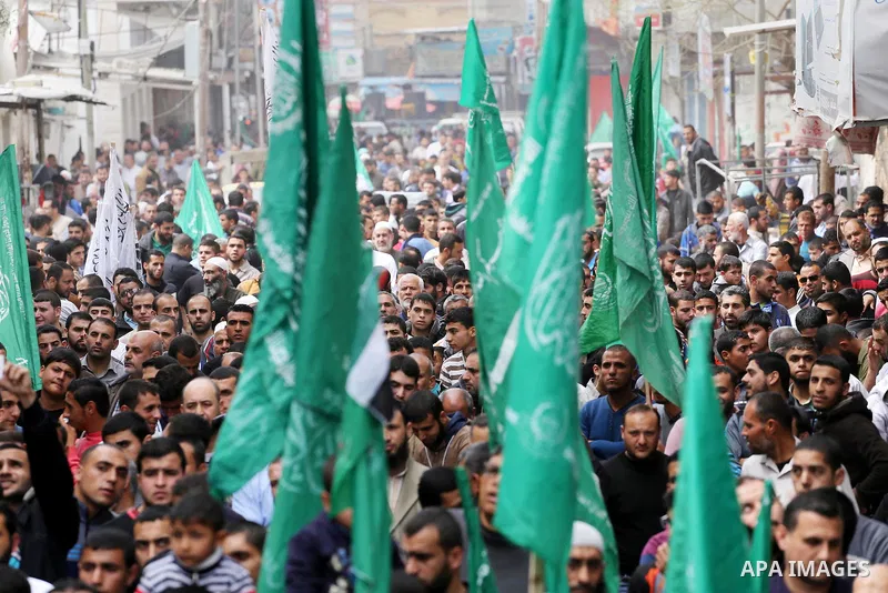Palestinian supporters of Hamas movement take part during a rally to mark the 12th anniversary of the death of assassinated Hamas spiritual leader Sheikh Ahmed Yassine and show solidarity with Palestinians in Jerusalem a...