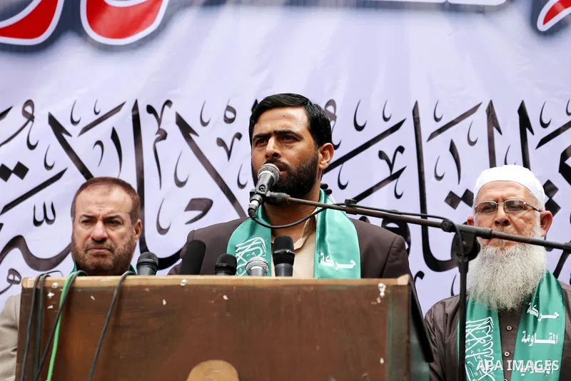 Mushir Al Masri, a Hamas MP and media spokesman speaks during a rally to mark the 12th anniversary of the death of assassinated Hamas spiritual leader Sheikh Ahmed Yassine and show solidarity with Palestinians in Jerusal...