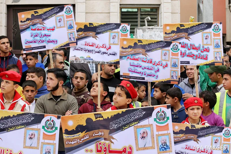Palestinian supporters of Hamas movement take part during a rally to mark the 12th anniversary of the death of assassinated Hamas spiritual leader Sheikh Ahmed Yassine and show solidarity with Palestinians in Jerusalem a...