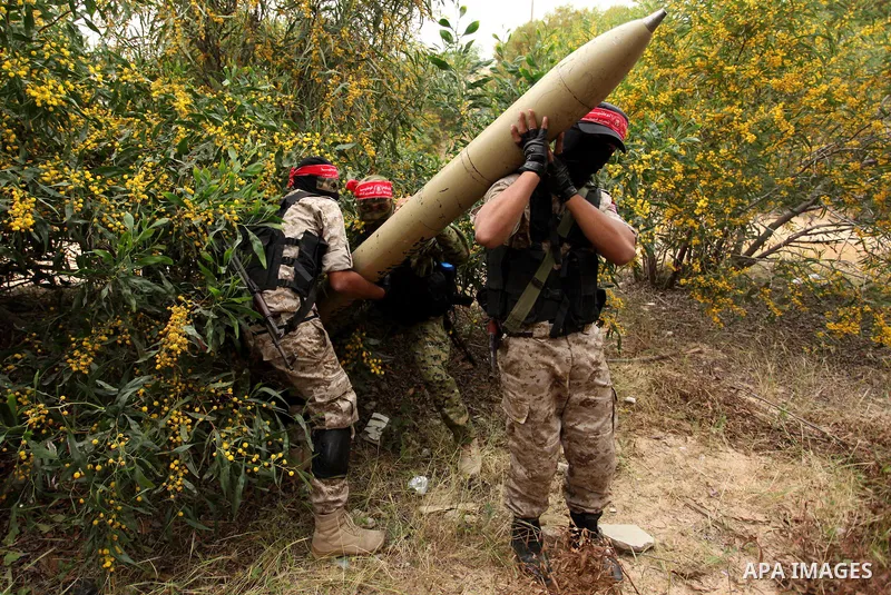 Palestinian militants show a home-made rocket to the media during an anti-Israel joint drill by National Resistance Brigades and Abdel Qader al Husseini Brigades in Khan Younis in the southern Gaza Strip March 25, 2016....