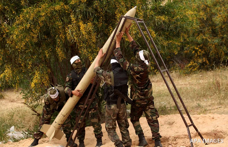 Palestinian militants show a home-made rocket to the media during an anti-Israel joint drill by National Resistance Brigades and Abdel Qader al Husseini Brigades in Khan Younis in the southern Gaza Strip March 25, 2016....