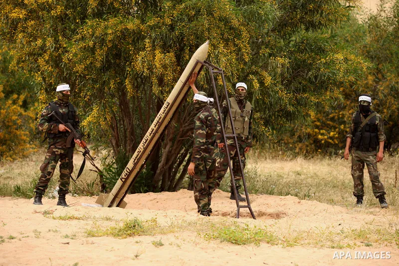 Palestinian militants show a home-made rocket to the media during an anti-Israel joint drill by National Resistance Brigades and Abdel Qader al Husseini Brigades in Khan Younis in the southern Gaza Strip March 25, 2016....