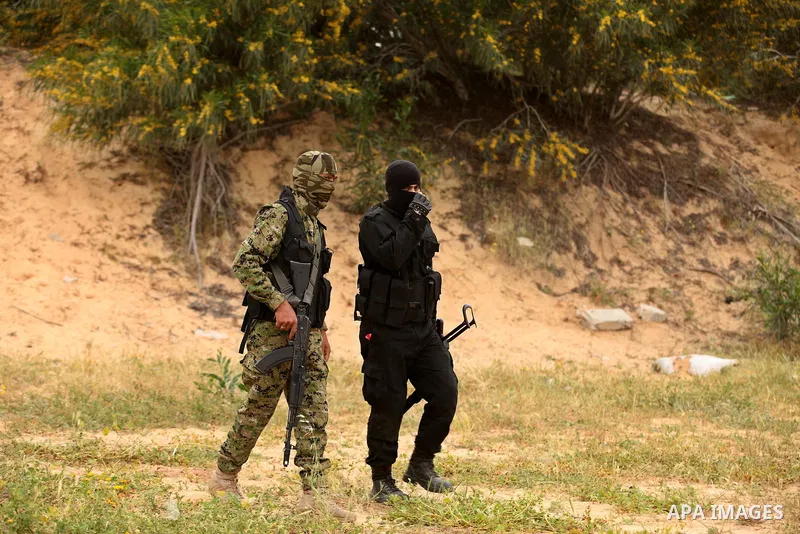Palestinian militants take part in an anti-Israel joint drill by National Resistance Brigades and Abdel Qader al Husseini Brigades in Khan Younis in the southern Gaza Strip March 25, 2016. Photo by Ashraf Amra