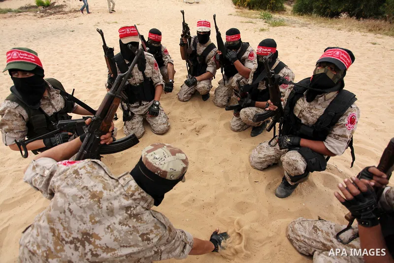 Palestinian militants take part in an anti-Israel joint drill by National Resistance Brigades and Abdel Qader al Husseini Brigades in Khan Younis in the southern Gaza Strip March 25, 2016. Photo by Ashraf Amra